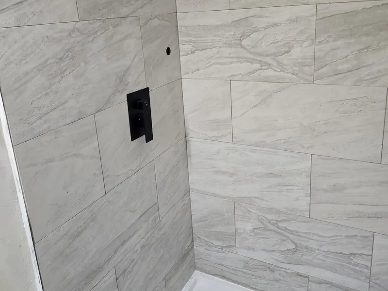Bathroom remodeling in Lynn, MA with large-format tile shower walls