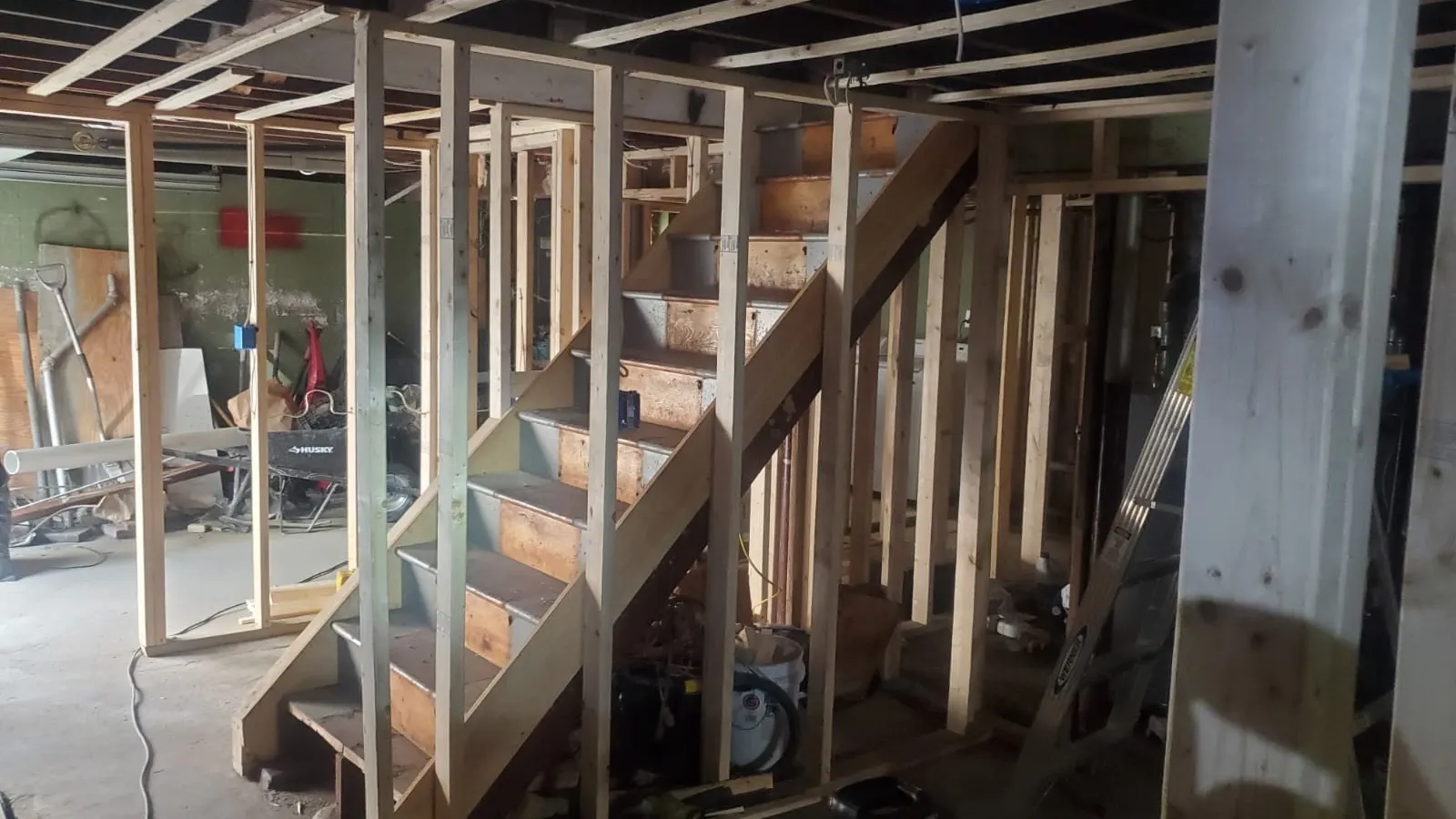 Carpentry in Lynn, MA showing basement framing and stairs