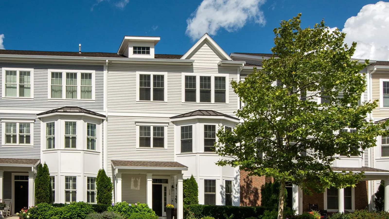 Service areas near Lynn, MA, a row of white townhomes on a residential street