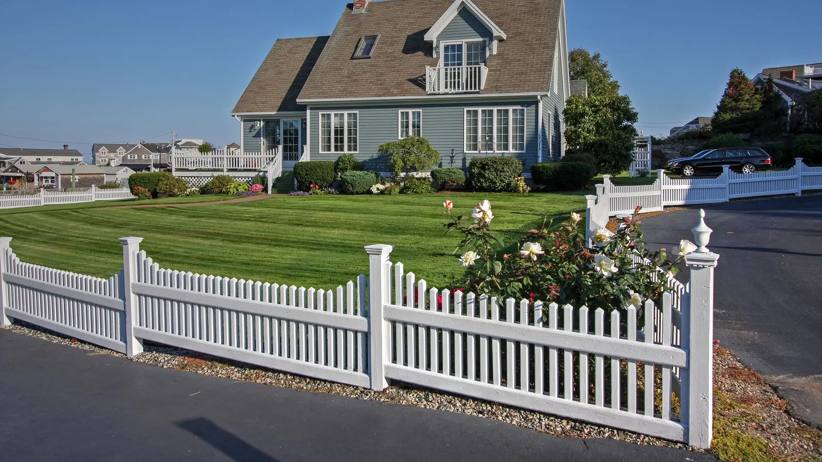 General contractor in Revere, MA, a coastal home with a white picket fence and lawn